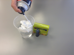 Spray a good dollop of shaving cream on top of your cup of water.