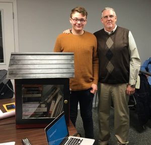 Jake Yoder, with Silver Grove Mayor Neal Beder, shows off his Little Free Library.